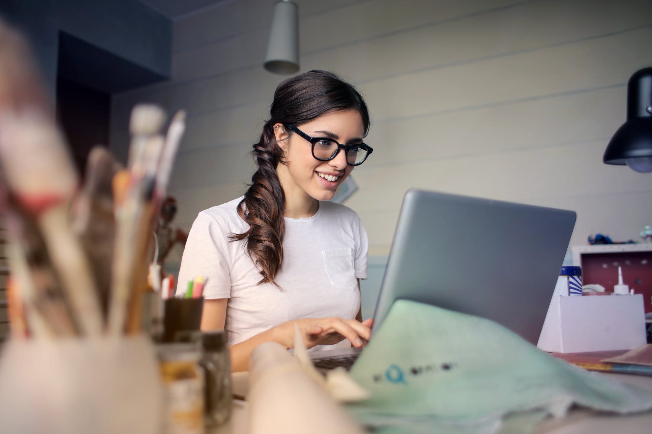 A woman working at a laptop