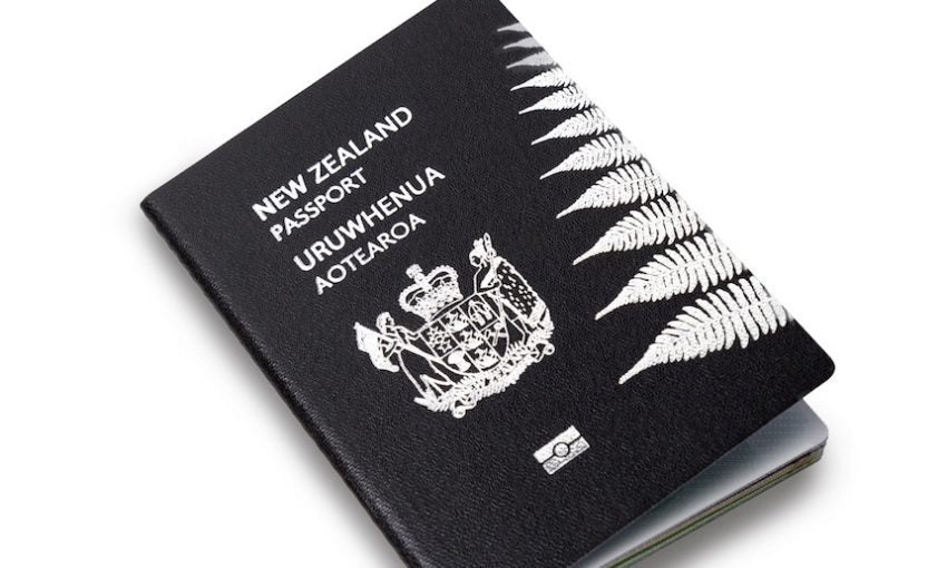 A New Zealand passport, black cover with the silver fern